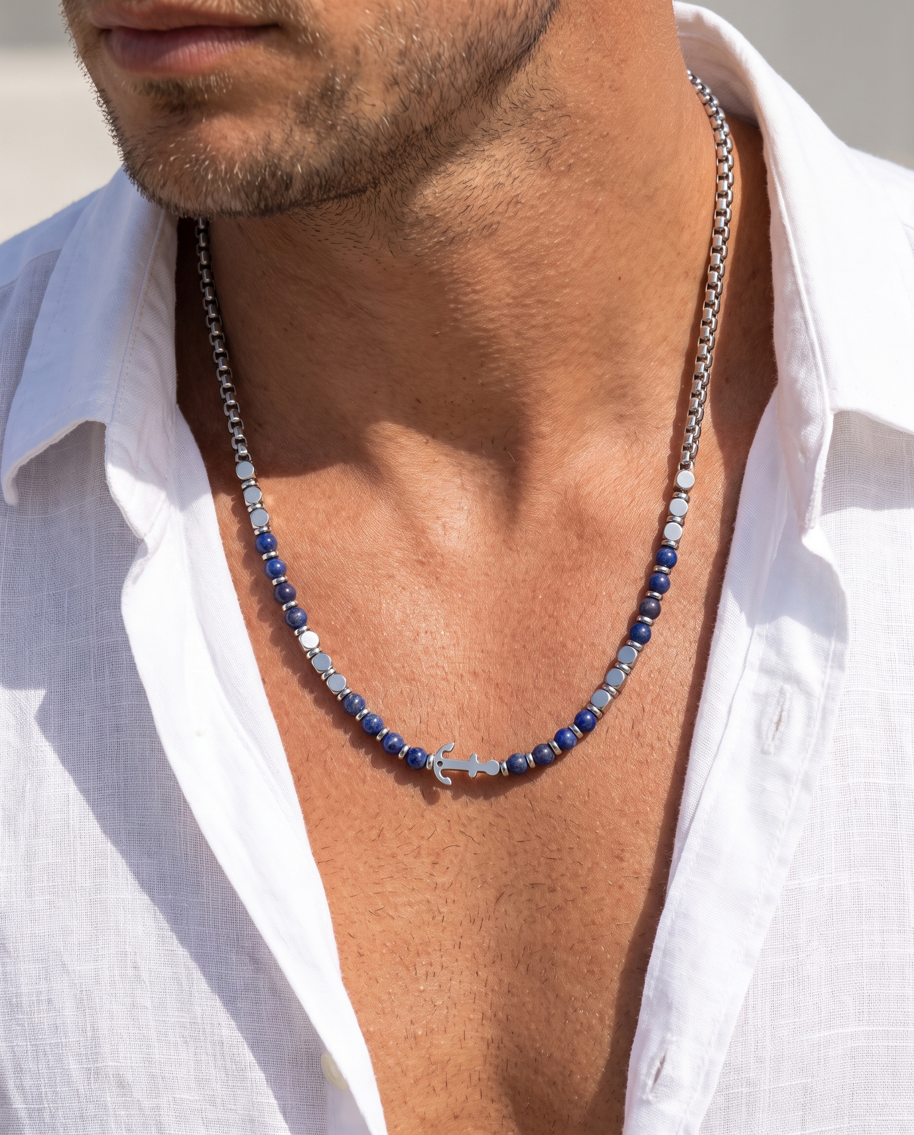Man wearing the Sarveni Anchor steel and lapis lazuli necklace