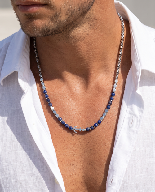 Man wearing the Sarveni Anchor steel and lapis lazuli necklace