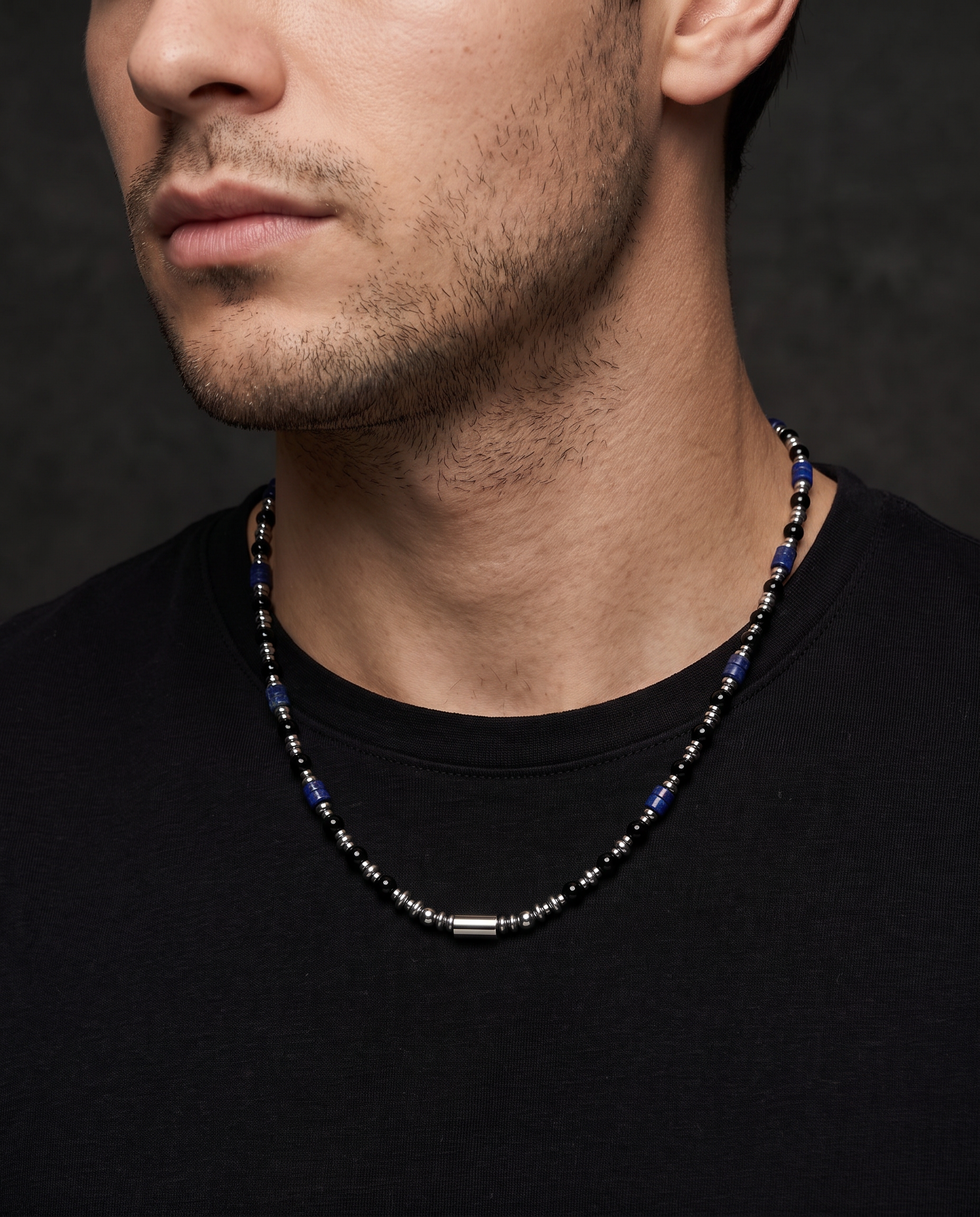 Man wearing the Sarveni Nocturne onyx and lapis lazuli necklace